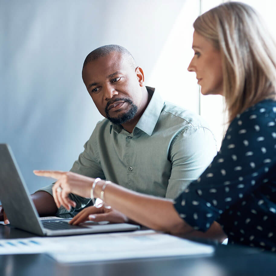 A woman and man look at the screen of a laptop computer. The Ohio lawyers at Horenstein, Nicholson & Blumenthal can help you with every type of workplace discrimination case.