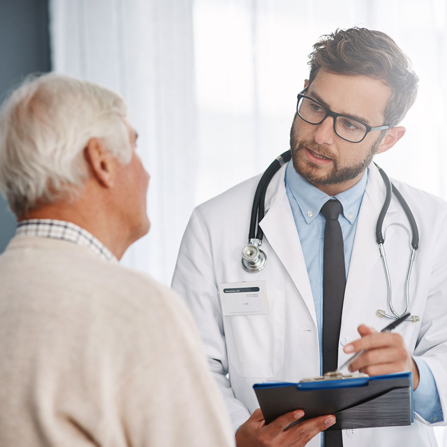A doctor speaks to a man. The Ohio workers’ compensation lawyers at Horenstein, Nicholson & Blumenthal help you secure the income and health coverage you need after a work injury.