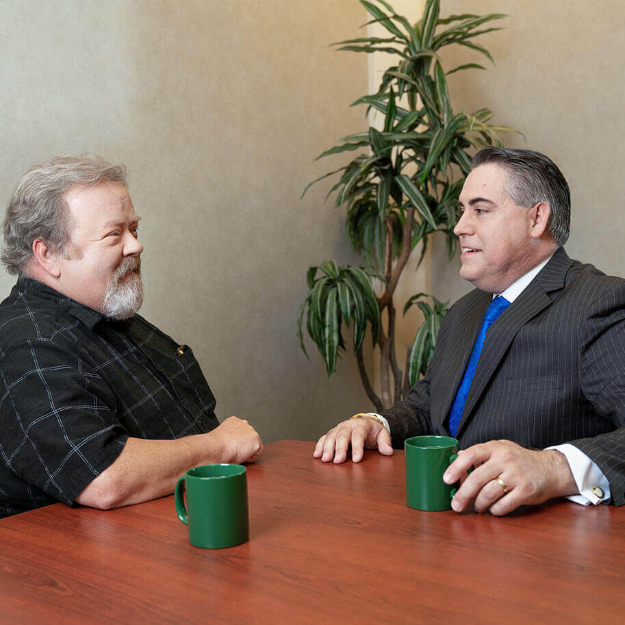 Attorney Fred Sommer meets with workers’ compensation client Brian Styx.