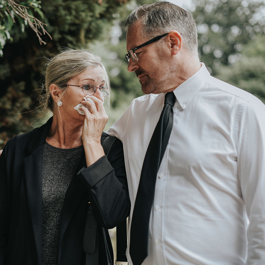 A man puts his arm around a woman holding a tissue to her face in a cemetery. When you lose a loved one in an accident, you could be entitled to various forms of compensation. Horenstein, Nicholson & Blumenthal lawyers can help.