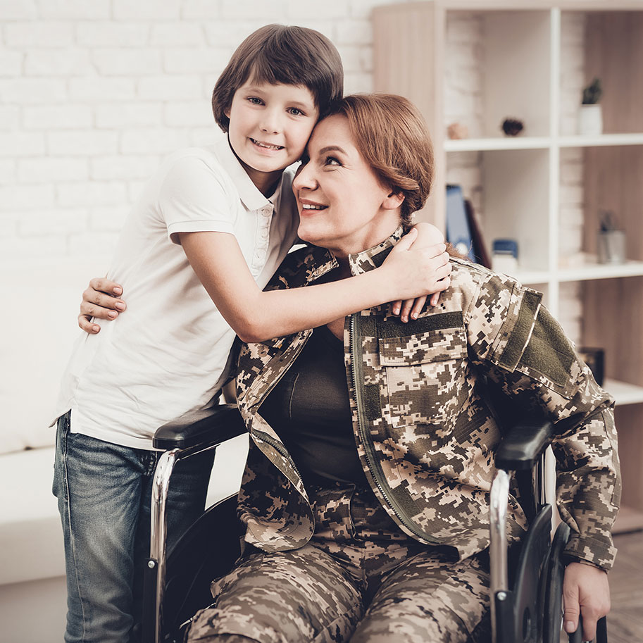 A woman in military attire in a wheelchair gets a hug from her child. No matter what condition you have, Horenstein, Nicholson & Blumenthal attorneys fight to get you the VA disability rating that’s fair for your service-connected health problems.