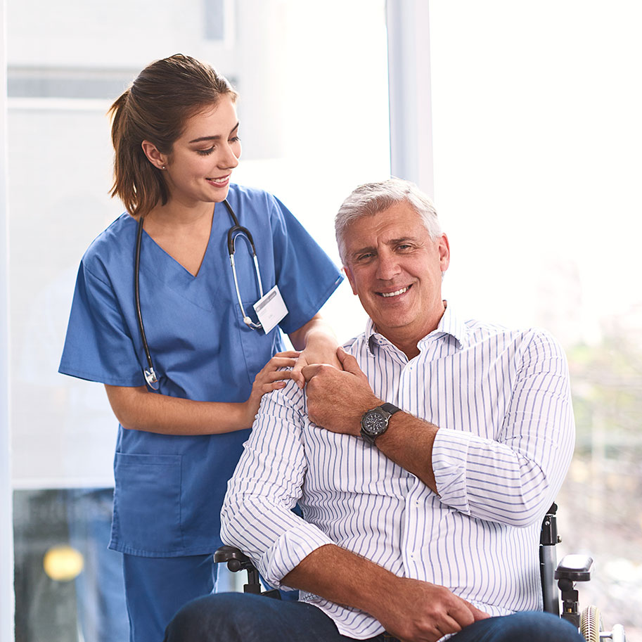 A doctor stands next to a man in a chair looking up at her. Horenstein, Nicholson & Blumenthal attorneys can help you qualify for different kinds of workers’ comp benefits for an aggravation of a pre-existing condition at work.