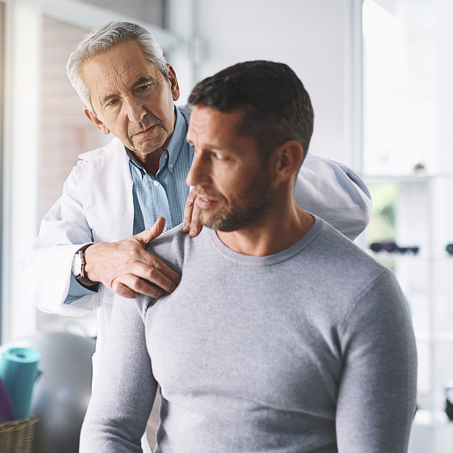 A doctor presses on a man’s shoulder. The school district employees’ workers’ compensation lawyers at Horenstein, Nicholson & Blumenthal fight for all the benefits due to you.